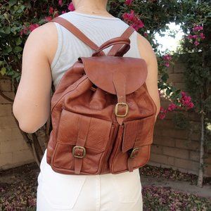 Vintage brown leather backpack with gold hardware